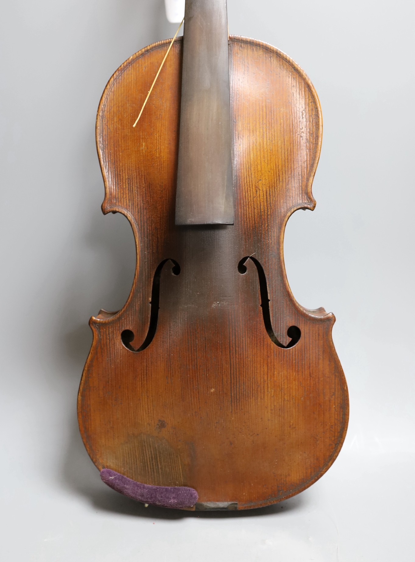 A cased 19th century violin, labelled Stradivarius 1690, with a Dodd bow